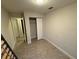 Bedroom featuring tile flooring and an empty closet at 9618 N 13Th St, Tampa, FL 33612