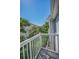 Relaxing balcony with white railing and bright sky view at 985 Wellington Ct, Dunedin, FL 34698