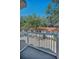 Private balcony offering views of the backyard and mature trees at 985 Wellington Ct, Dunedin, FL 34698