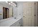 Bathroom with modern vanity, large mirror, and stylish lighting at 985 Wellington Ct, Dunedin, FL 34698