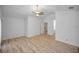 Spacious bedroom with vaulted ceilings, ceiling fan, and wood-look flooring at 985 Wellington Ct, Dunedin, FL 34698