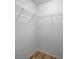 Corner of the closet with laminate flooring and wire shelving system at 985 Wellington Ct, Dunedin, FL 34698