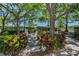 Serene community space with comfortable seating, lush landscaping, and easy access to walkways at 985 Wellington Ct, Dunedin, FL 34698