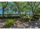 Scenic community space with lush greenery and seating offers a peaceful outdoor retreat at 985 Wellington Ct, Dunedin, FL 34698