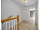 Bright hallway with wood-look floors and natural light from nearby windows at 985 Wellington Ct, Dunedin, FL 34698