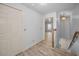 Hallway with wood flooring, closet, and entry to an adjacent room at 985 Wellington Ct, Dunedin, FL 34698