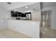 Modern kitchen featuring stainless steel appliances and a breakfast bar at 985 Wellington Ct, Dunedin, FL 34698
