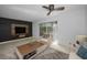 Living room featuring tile flooring, modern furniture, and a large TV at 985 Wellington Ct, Dunedin, FL 34698