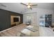 Comfortable primary bedroom with wood-look floors and a sliding glass door leading to a balcony at 985 Wellington Ct, Dunedin, FL 34698