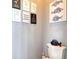 Charming bathroom decor with whimsical signs and a decorative fish accent above the toilet at 1023 Orca Ct, Holiday, FL 34691