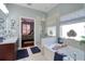 Bathroom featuring a soaking tub, glass shower, and double sinks, adjacent to the bedroom at 1023 Orca Ct, Holiday, FL 34691