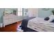 Bright bedroom with hardwood floors, coordinated decor, and a cozy, inviting atmosphere at 1023 Orca Ct, Holiday, FL 34691