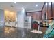 Kitchen with granite counters, stainless appliances, dark wood cabinets, and eat in nook at 1023 Orca Ct, Holiday, FL 34691
