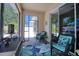 Inviting screened-in lanai with wicker seating and a view of the outdoors at 1023 Orca Ct, Holiday, FL 34691