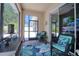 Inviting screened-in lanai with wicker seating and a view of the outdoors at 1023 Orca Ct, Holiday, FL 34691