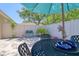 Charming patio area with outdoor seating, decorated with floral accents and a decorative fish at 1023 Orca Ct, Holiday, FL 34691