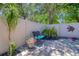 Paver patio featuring a bench, tropical landscaping, and a white fence for added privacy and style at 1023 Orca Ct, Holiday, FL 34691