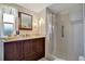 Well-lit bathroom featuring vanity, mirror, and convenient walk-in shower at 104 Saint Kitts Way, Apollo Beach, FL 33572
