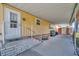 Charming covered entryway with stairs, porch, and convenient access to the home at 104 Saint Kitts Way, Apollo Beach, FL 33572