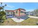 Charming single-story home with a screened-in porch and awning-shaded windows at 104 Saint Kitts Way, Apollo Beach, FL 33572