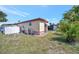 Exterior view of home featuring well-maintained yard and shed for extra storage at 104 Saint Kitts Way, Apollo Beach, FL 33572