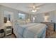 Inviting main bedroom with neutral tones, ceiling fan, and a calming ambiance at 104 Saint Kitts Way, Apollo Beach, FL 33572