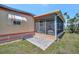 Outdoor porch featuring screen enclosure and view into the home's interior at 104 Saint Kitts Way, Apollo Beach, FL 33572