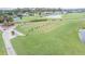 Aerial view of the driving range and golf course at 10809 Collar Dr, San Antonio, FL 33576