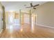 Open living room with laminate flooring and a front door at 10809 Collar Dr, San Antonio, FL 33576