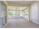 Bright sunroom features multiple windows offering lots of sunlight and views of the outdoors at 10809 Collar Dr, San Antonio, FL 33576