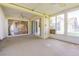 Enclosed sunroom with ceiling fans and sliding doors with views of the outdoors at 10809 Collar Dr, San Antonio, FL 33576