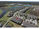 This aerial view displays the community amenities, pond views and local shopping at 10947 Verawood Dr, Riverview, FL 33579