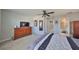 Light-filled bedroom featuring ceiling fan and an ensuite bathroom at 10947 Verawood Dr, Riverview, FL 33579