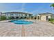 Sparkling community pool with a unique shape, spacious sundeck and nearby clubhouse amenities at 10947 Verawood Dr, Riverview, FL 33579