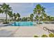 Beautiful community pool area with cabanas, sun loungers, and palm trees for a relaxing atmosphere at 10947 Verawood Dr, Riverview, FL 33579