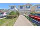 Attractive townhomes feature a well-manicured lawn and private driveways at 10947 Verawood Dr, Riverview, FL 33579