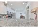 Modern kitchen featuring sleek granite countertops, stainless steel appliances, and stylish white cabinetry at 10947 Verawood Dr, Riverview, FL 33579