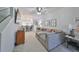 Inviting living room with open layout and stylish furniture, flowing into the kitchen at 10947 Verawood Dr, Riverview, FL 33579