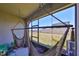 Relaxing screened patio with two hammocks overlooking the fenced backyard at 10947 Verawood Dr, Riverview, FL 33579