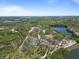 Aerial shot highlighting the scenic walking paths, tranquil lakes, and lush greenery of this serene community at 110 Parkside Colony Dr, Tarpon Springs, FL 34689