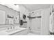 Updated bathroom features subway tile in shower-tub combo with white sink at 110 Parkside Colony Dr, Tarpon Springs, FL 34689