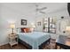 Cozy bedroom with natural light, featuring a comfortable bed, side tables with lamps, and an area rug at 110 Parkside Colony Dr, Tarpon Springs, FL 34689