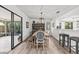 Bright dining room featuring a modern table, stylish chairs, and access to the outdoor patio at 110 Parkside Colony Dr, Tarpon Springs, FL 34689