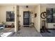 Welcoming front entrance with decorative art, tiled flooring and charming details at 110 Parkside Colony Dr, Tarpon Springs, FL 34689