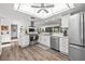 Spacious kitchen with stainless steel appliances, white cabinetry, and modern lighting at 110 Parkside Colony Dr, Tarpon Springs, FL 34689
