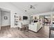 Comfortable living room with built-in bookshelves, fireplace, and access to outdoor patio at 110 Parkside Colony Dr, Tarpon Springs, FL 34689