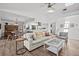 Spacious living room with an open floor plan, vaulted ceiling, and views of the dining area and kitchen at 110 Parkside Colony Dr, Tarpon Springs, FL 34689