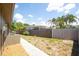 Fenced backyard featuring ample space, mature trees and a well-maintained lawn at 11797 David Ct, Largo, FL 33778