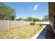 Fenced backyard featuring a hot tub and fire pit at 11797 David Ct, Largo, FL 33778