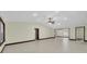 Spacious open-concept living room with recessed lighting and neutral tile flooring at 11797 David Ct, Largo, FL 33778